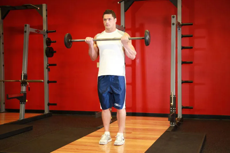Bicep curl met barbell, eindpositie