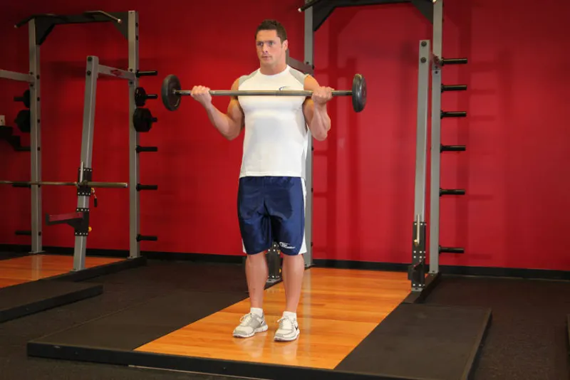 Curl met barbell, brede grip, eindpositie