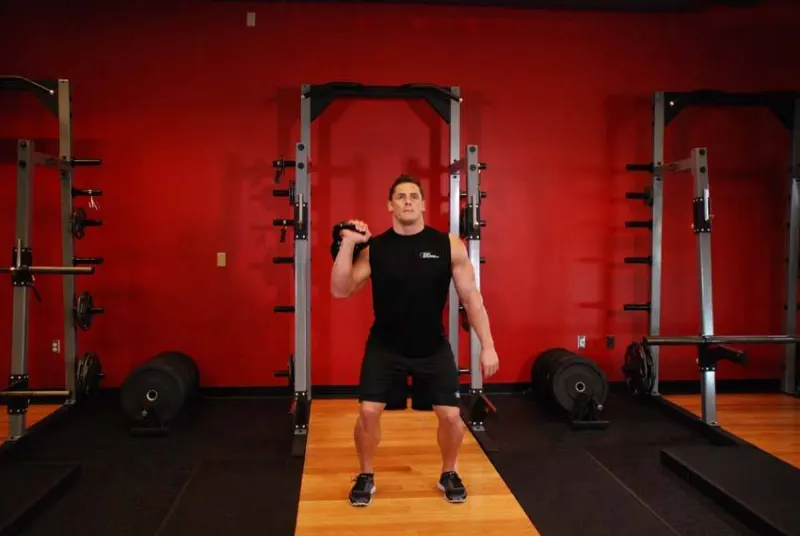 Kettlebell jerk met één arm, eindpositie