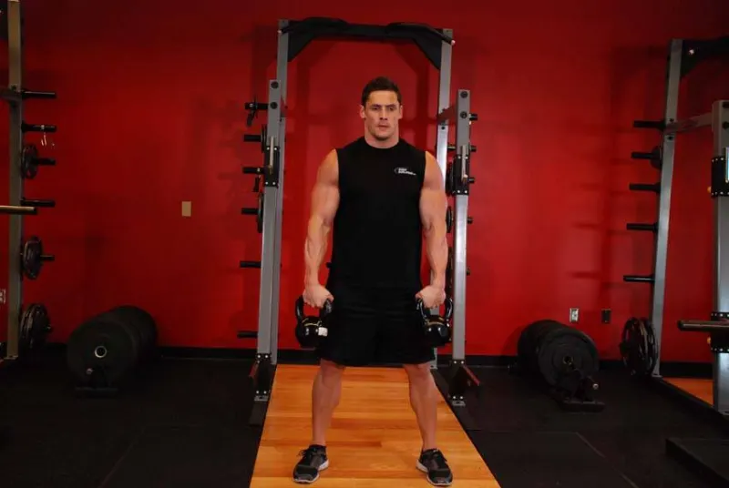 Kettlebell snatch met twee kettlebells, beginpositie