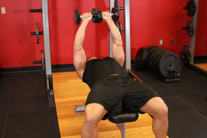 Tate press met dumbbells, eindpositie