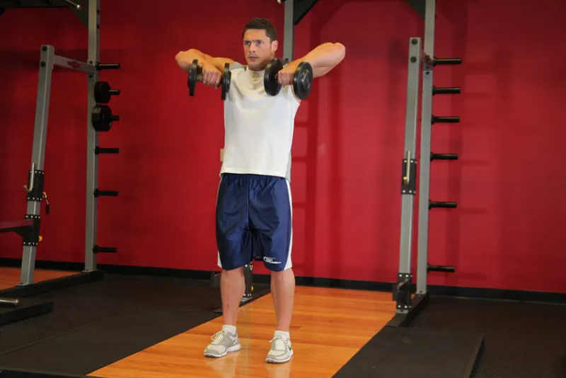 Upright row met dumbbells